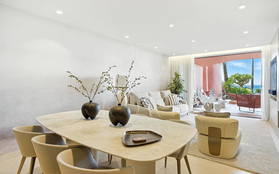 Impeccably renovated, south facing beach front, garden apartment located in the exclusive Menara Beach community on the sought-after New Golden Mile