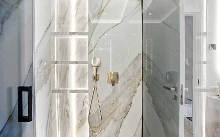 Impeccably renovated, south facing beach front, garden apartment located in the exclusive Menara Beach community on the sought-after New Golden Mile