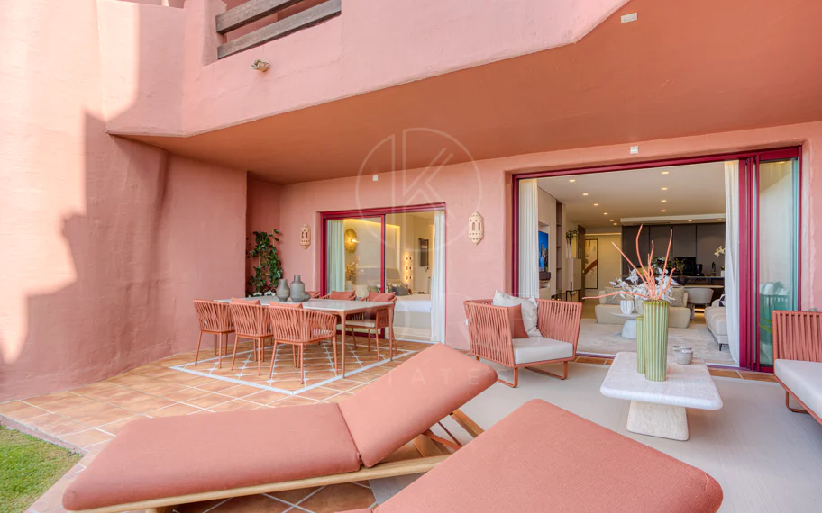 Impeccably renovated, south facing beach front, garden apartment located in the exclusive Menara Beach community on the sought-after New Golden Mile