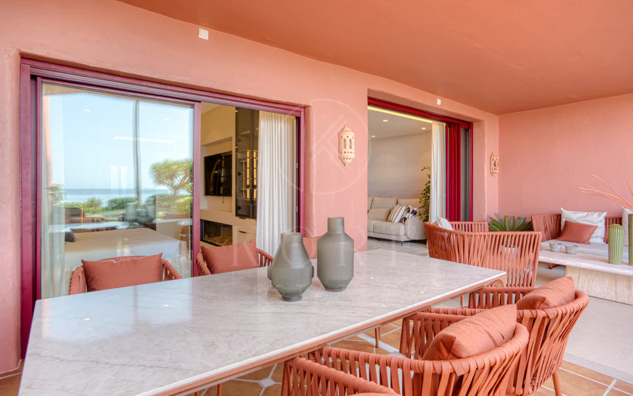 Impeccably renovated, south facing beach front, garden apartment located in the exclusive Menara Beach community on the sought-after New Golden Mile