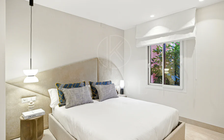 Impeccably renovated, south facing beach front, garden apartment located in the exclusive Menara Beach community on the sought-after New Golden Mile