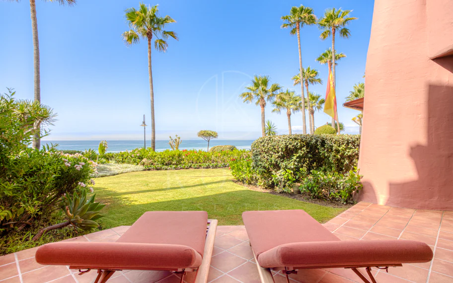 Impeccably renovated, south facing beach front, garden apartment located in the exclusive Menara Beach community on the sought-after New Golden Mile