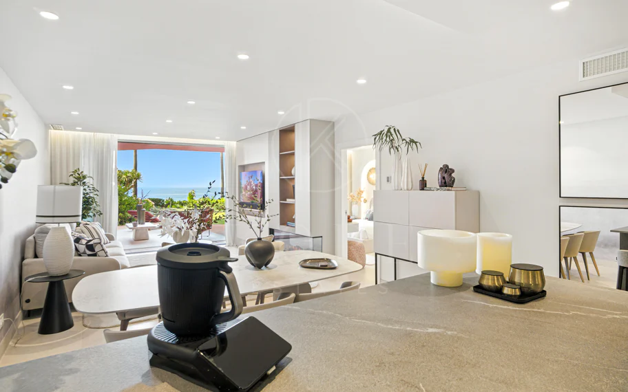 Impeccably renovated, south facing beach front, garden apartment located in the exclusive Menara Beach community on the sought-after New Golden Mile