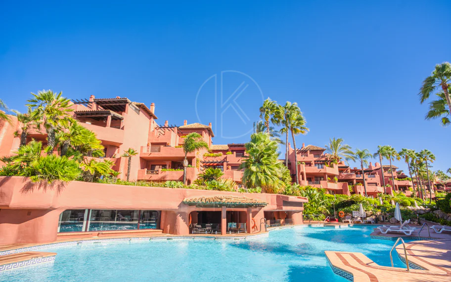 Impeccably renovated, south facing beach front, garden apartment located in the exclusive Menara Beach community on the sought-after New Golden Mile