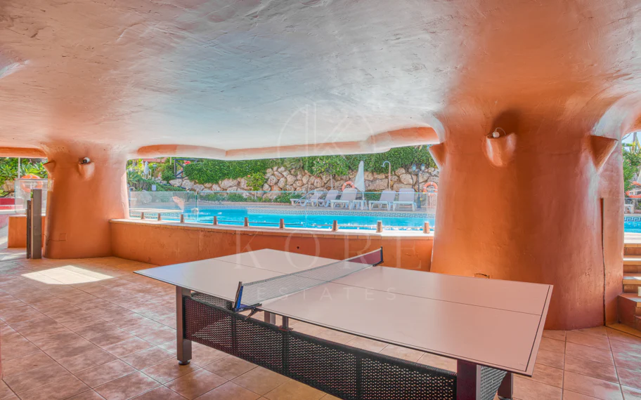 Impeccably renovated, south facing beach front, garden apartment located in the exclusive Menara Beach community on the sought-after New Golden Mile