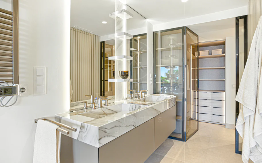 Impeccably renovated, south facing beach front, garden apartment located in the exclusive Menara Beach community on the sought-after New Golden Mile