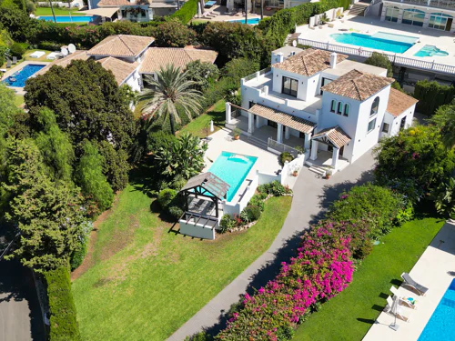 Traditional five-bedroom villa with private pool, mature gardens and partial sea views in El Rosario, East Marbella.