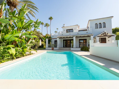 Traditional five-bedroom villa with private pool, mature gardens and partial sea views in El Rosario, East Marbella.