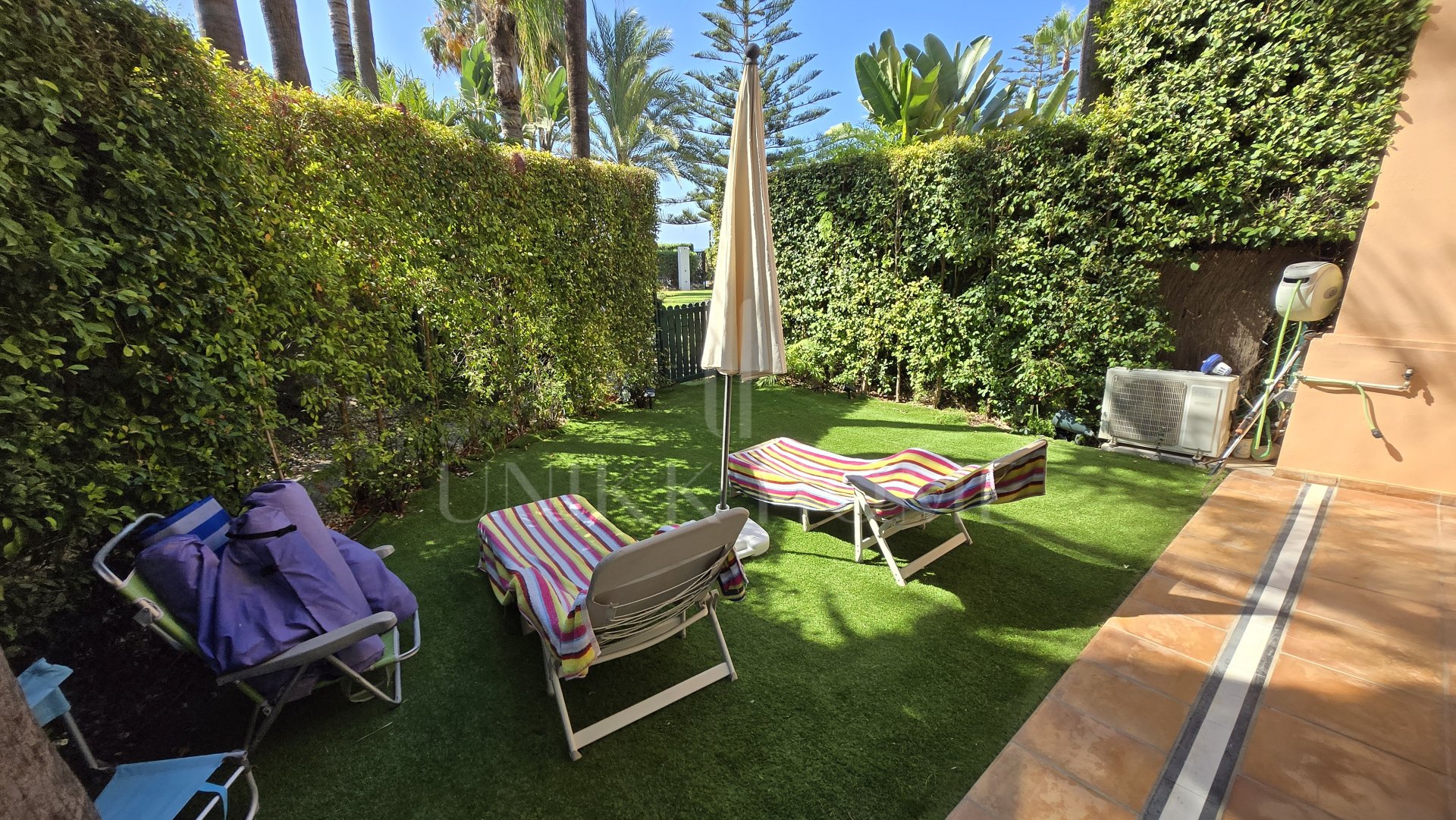 Exclusive luxury ground floor apartment with garden on the first line beach of Puerto Banús