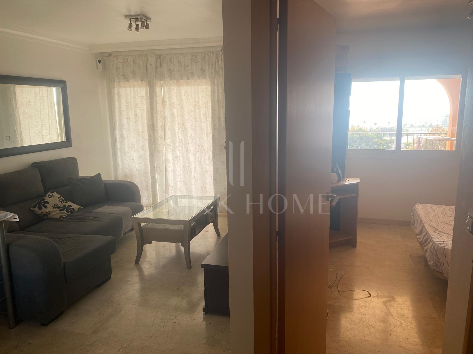 One-bedroom apartment with huge terrace and sea and golf views