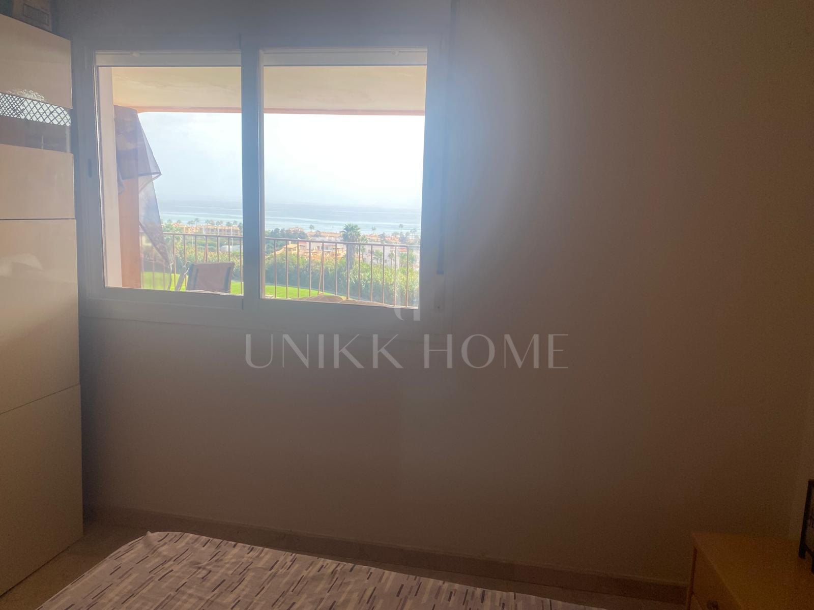 One-bedroom apartment with huge terrace and sea and golf views