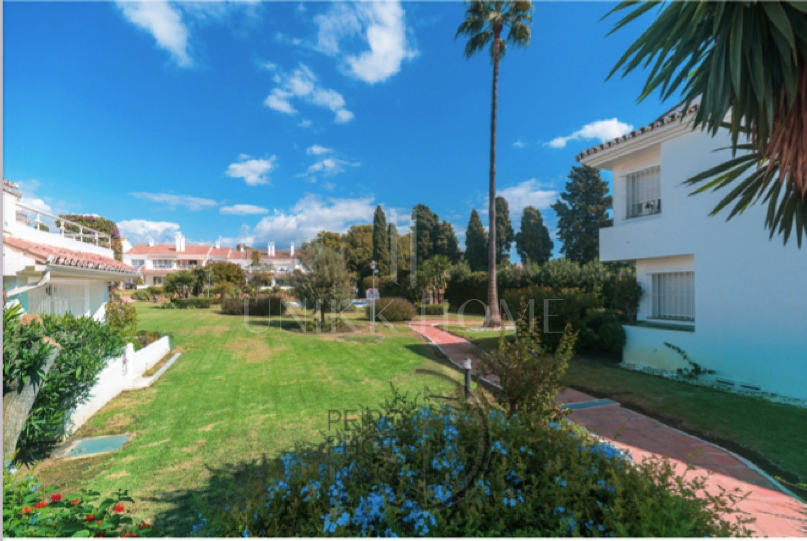 Elegant, bright apartment with large terrace & direct garden access in a tranquil gated community