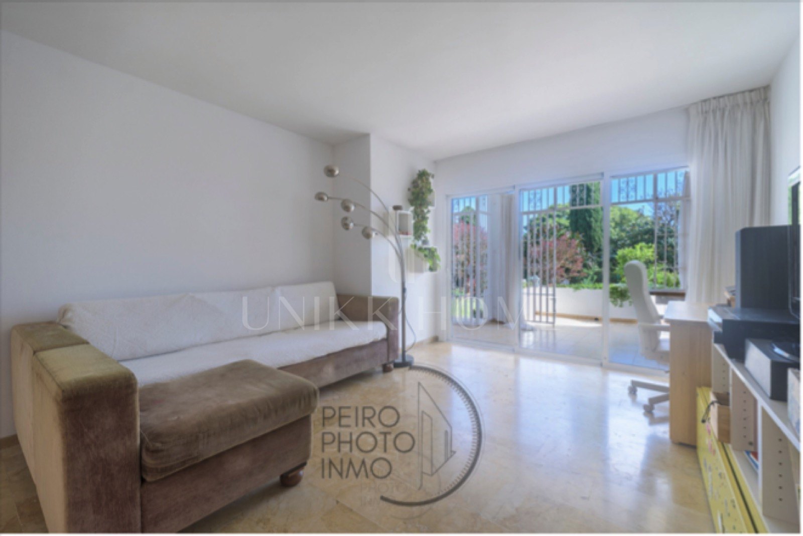 Elegant, bright apartment with large terrace & direct garden access in a tranquil gated community