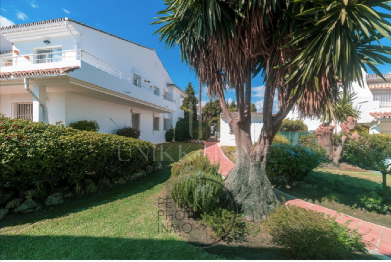 Elegant, bright apartment with large terrace & direct garden access in a tranquil gated community