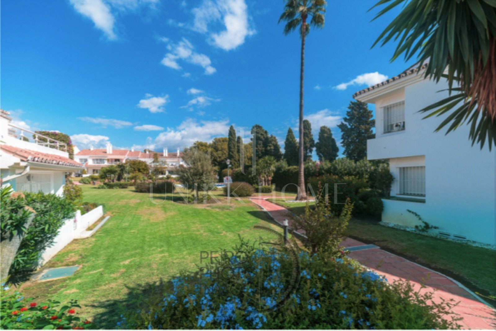 Elegant, bright apartment with large terrace & direct garden access in a tranquil gated community