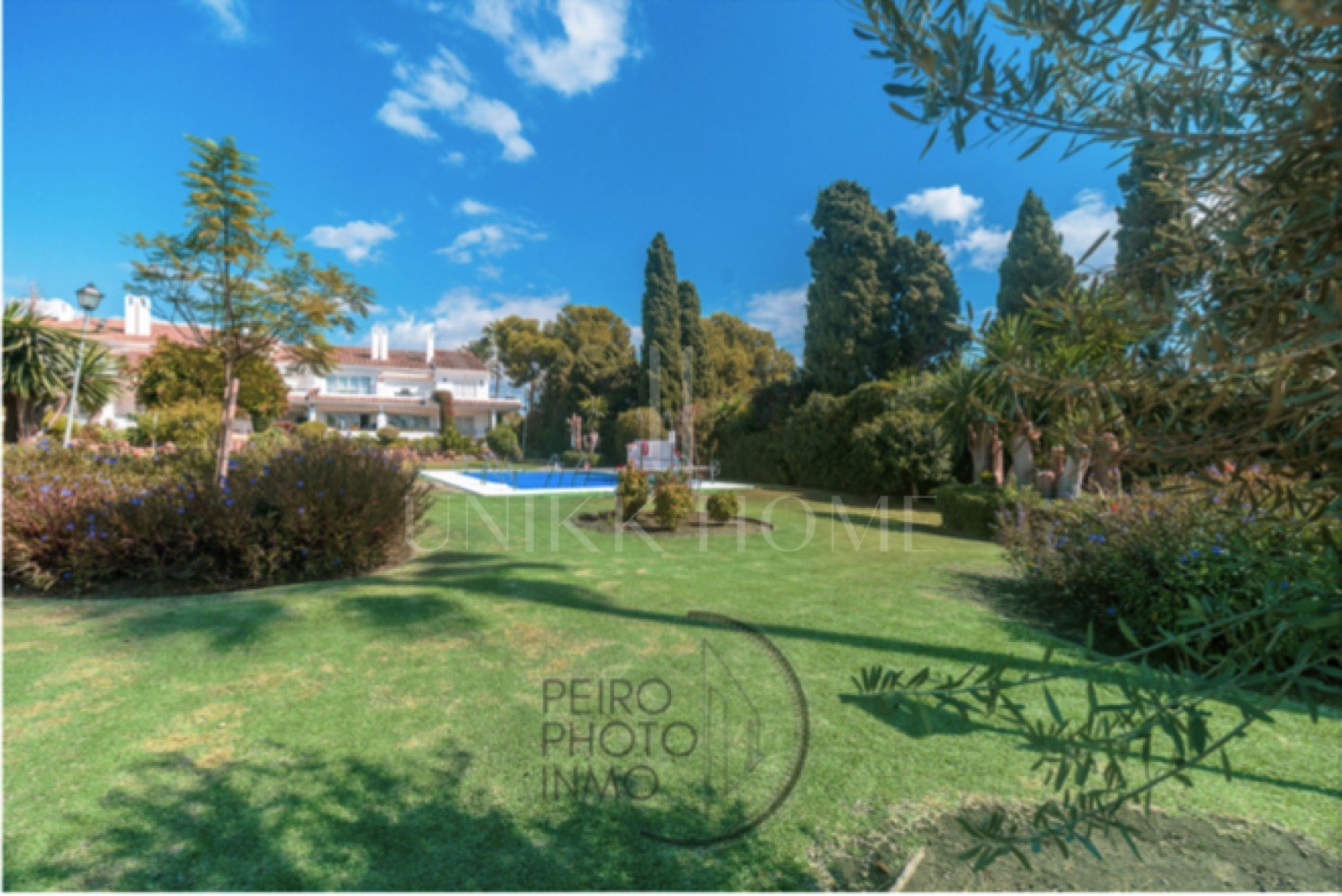 Elegant, bright apartment with large terrace & direct garden access in a tranquil gated community