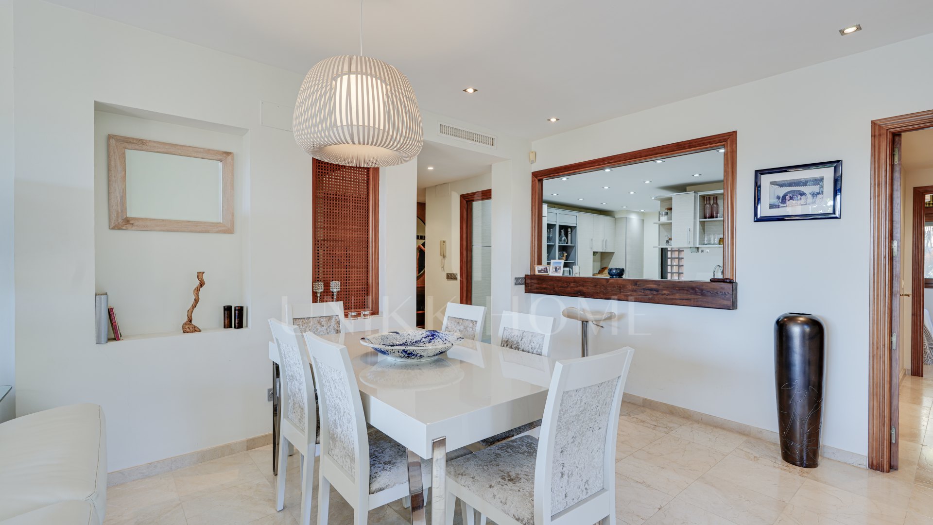 Mediterranean-style duplex penthouse with multiple terraces and a rooftop terrace with a private sauna and barbecue area