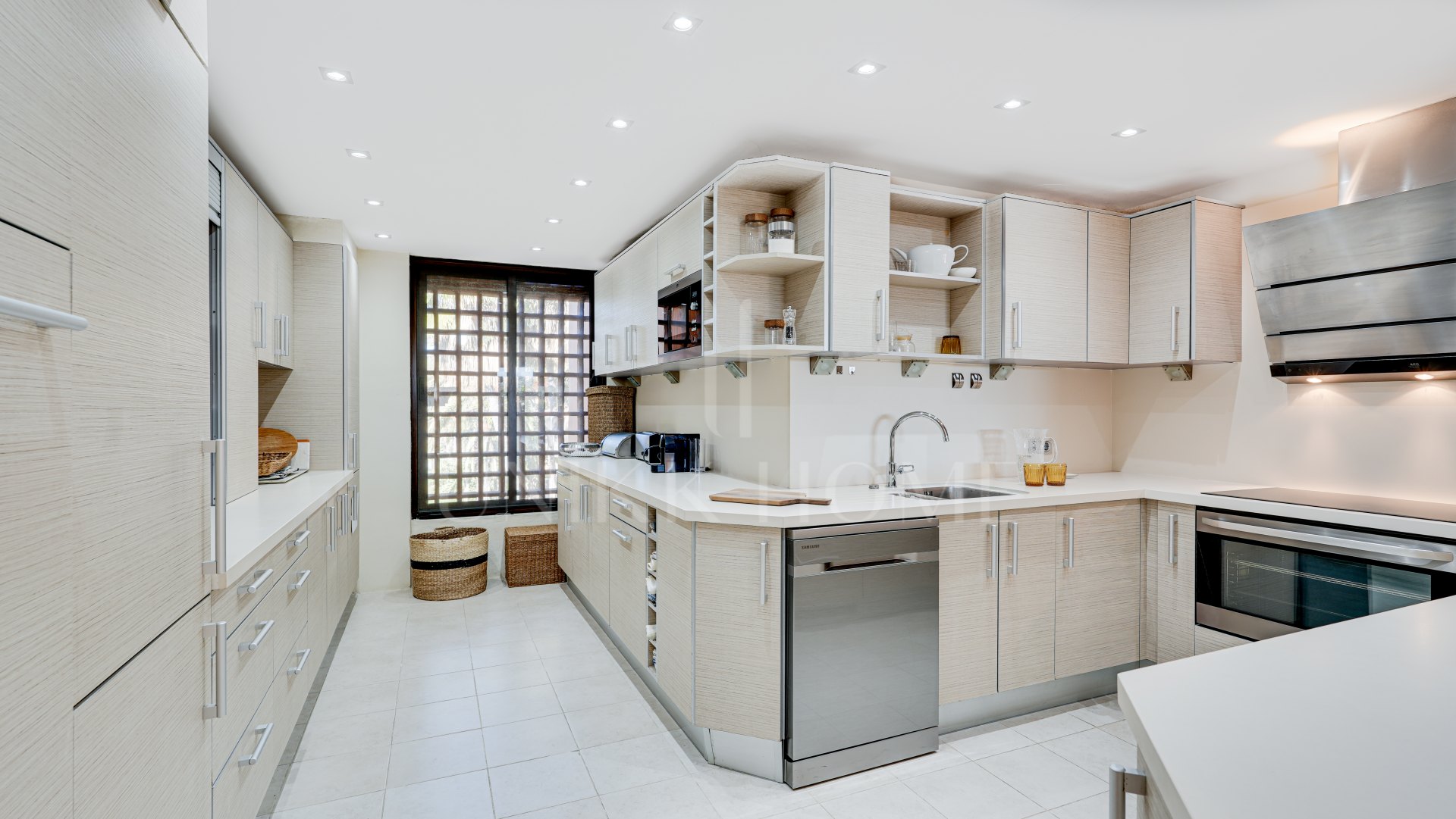 Mediterranean-style duplex penthouse with multiple terraces and a rooftop terrace with a private sauna and barbecue area