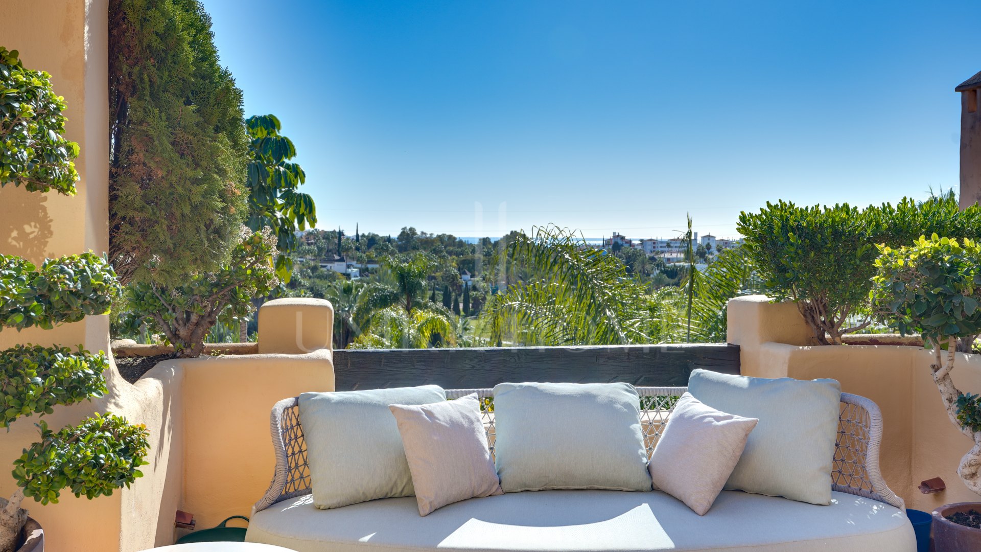 Mediterranean-style duplex penthouse with multiple terraces and a rooftop terrace with a private sauna and barbecue area