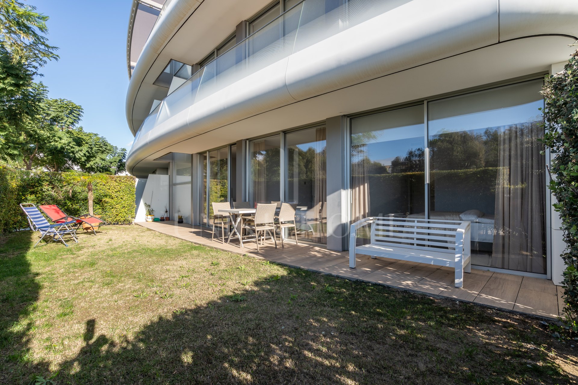 Luxurious beachfront apartment with private garden