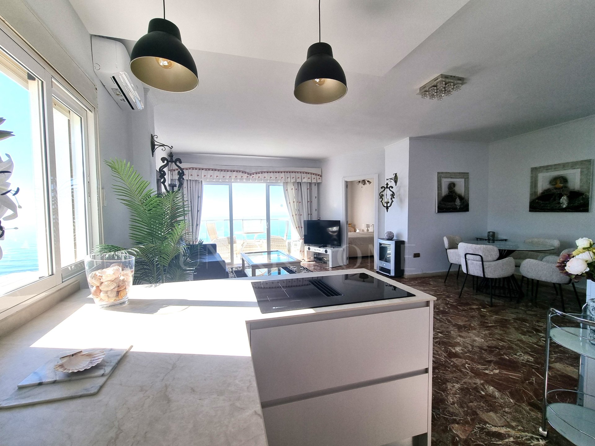 This exclusive 4th-floor apartment is a true coastal sanctuary, offering uninterrupted sea views and direct access to pristine beaches and lush communal gardens.