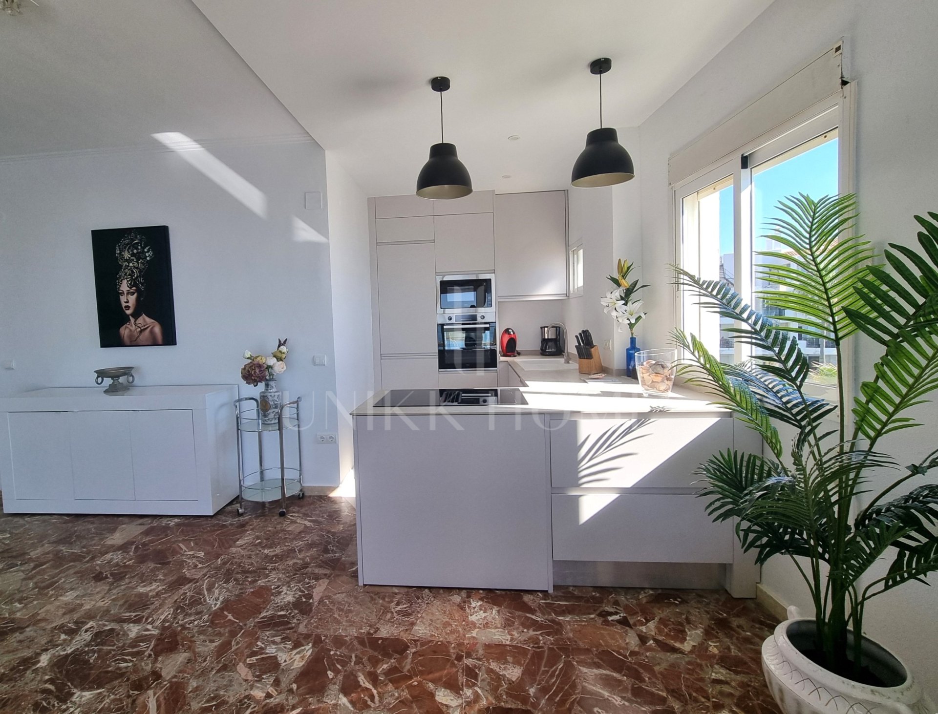This exclusive 4th-floor apartment is a true coastal sanctuary, offering uninterrupted sea views and direct access to pristine beaches and lush communal gardens.