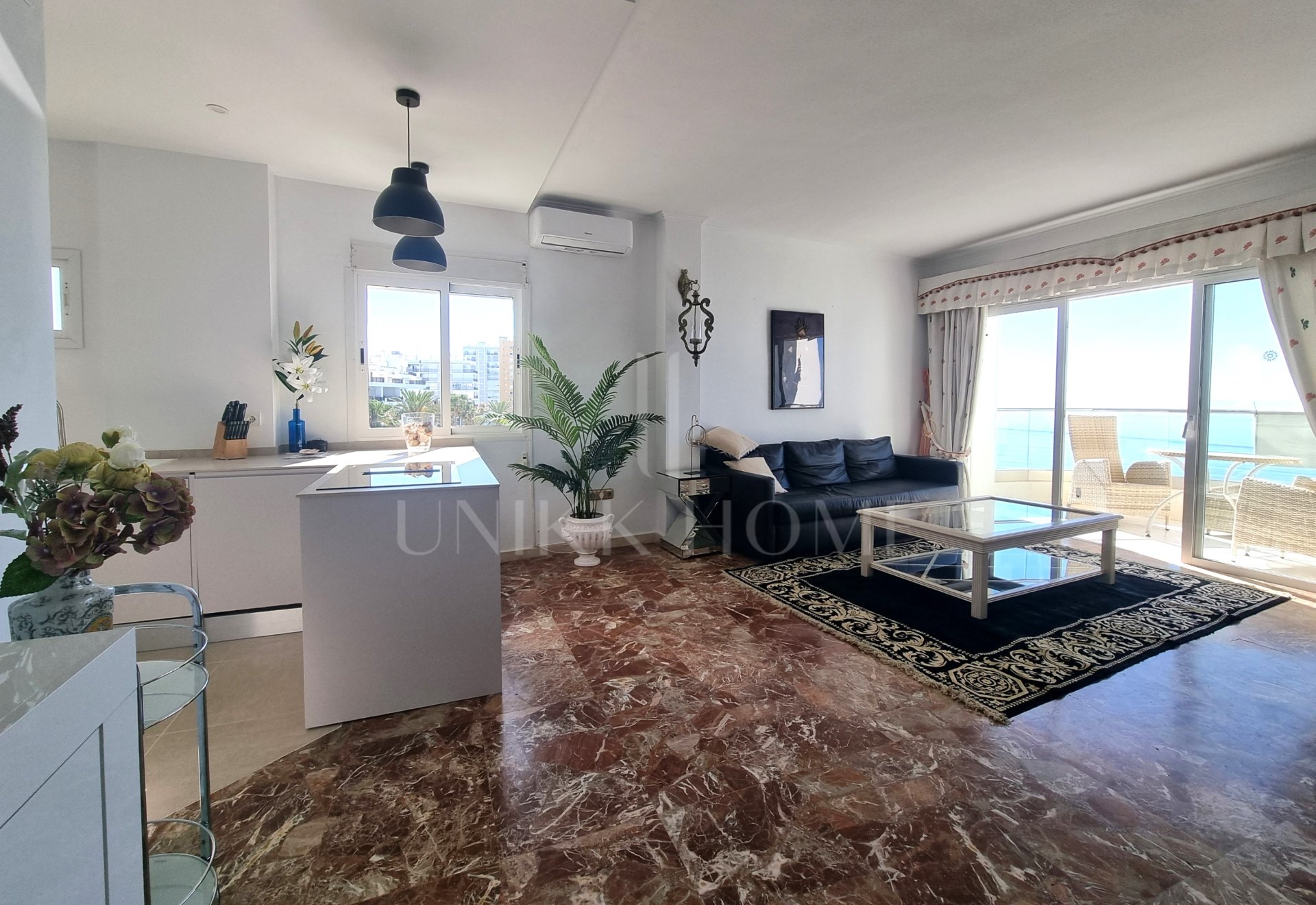 This exclusive 4th-floor apartment is a true coastal sanctuary, offering uninterrupted sea views and direct access to pristine beaches and lush communal gardens.