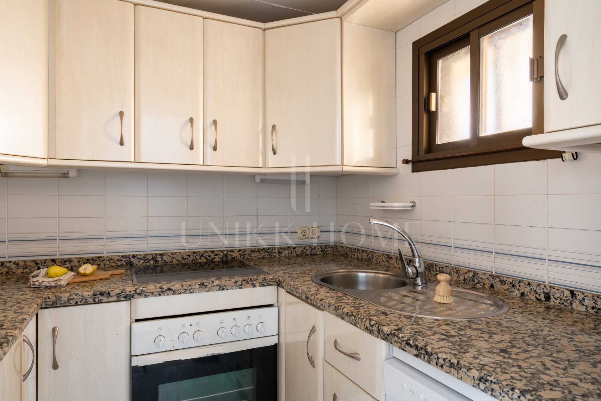 First-line beach home with sea views