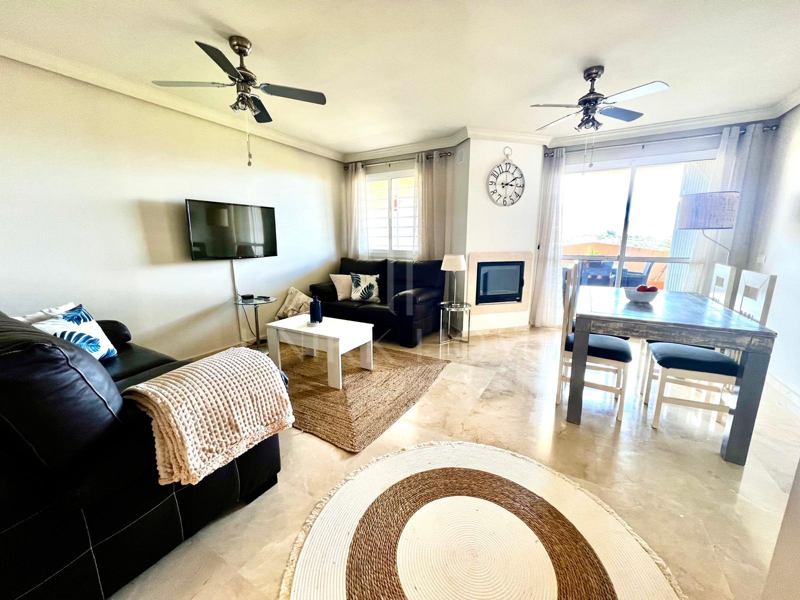 Stylish 2-bedroom apartment in Duquesa Fairways with two private terraces, golf views, and access to pools, gardens, and underground parking—just minutes from the marina and beach.