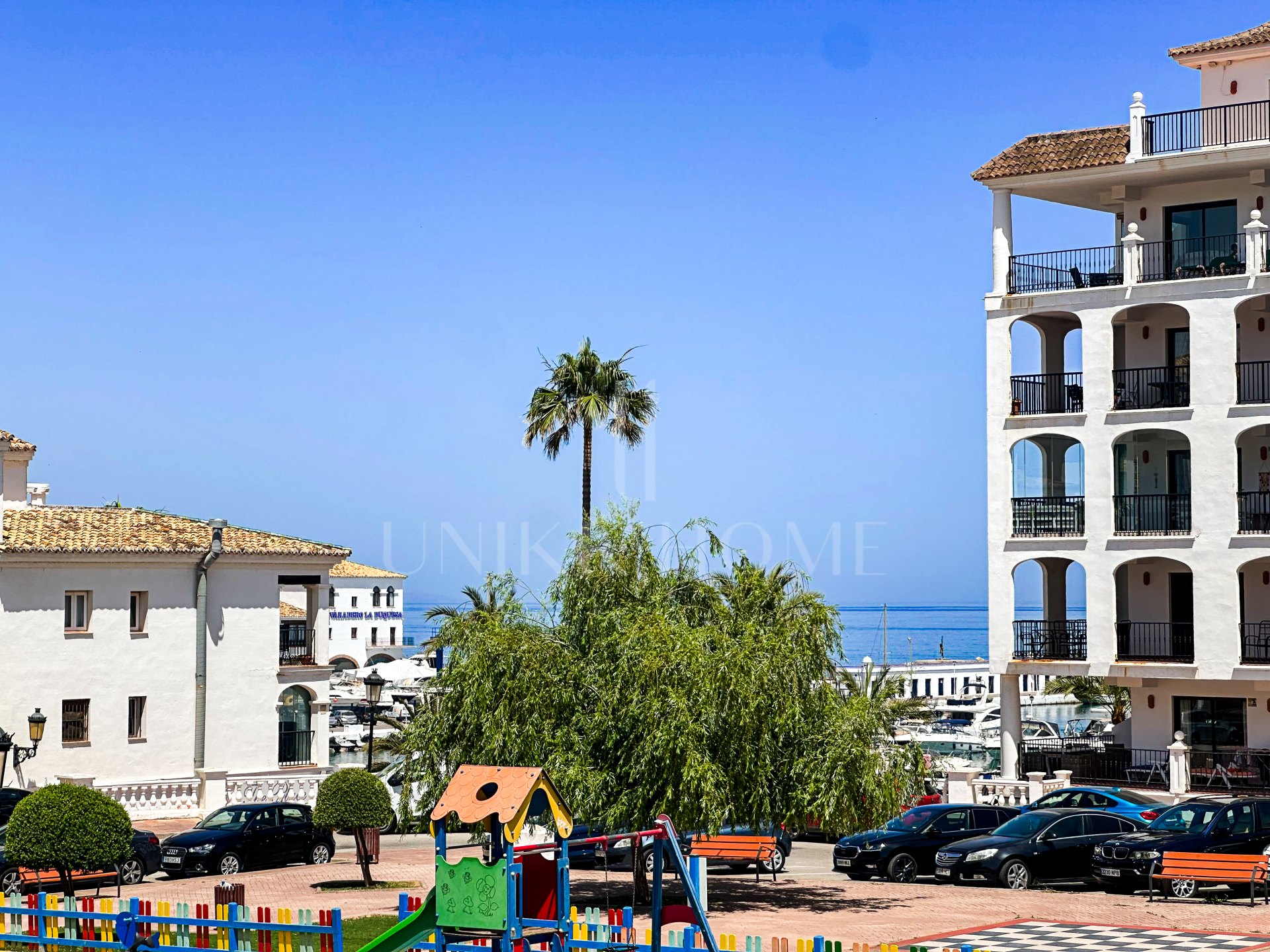 Semi detached house in Puerto La Duquesa with a sun terrace, sea views and a private garage for just €375,000
