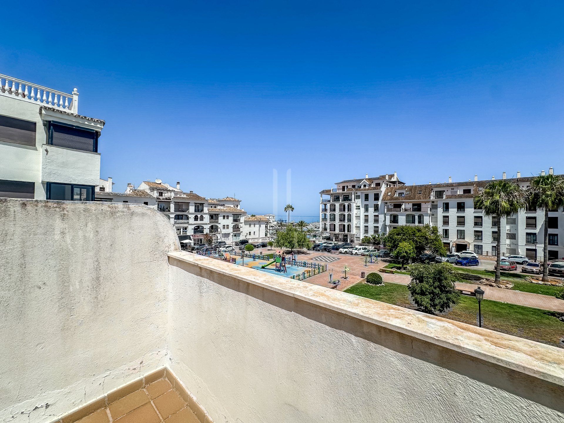 Semi detached house in Puerto La Duquesa with a sun terrace, sea views and a private garage for just €375,000