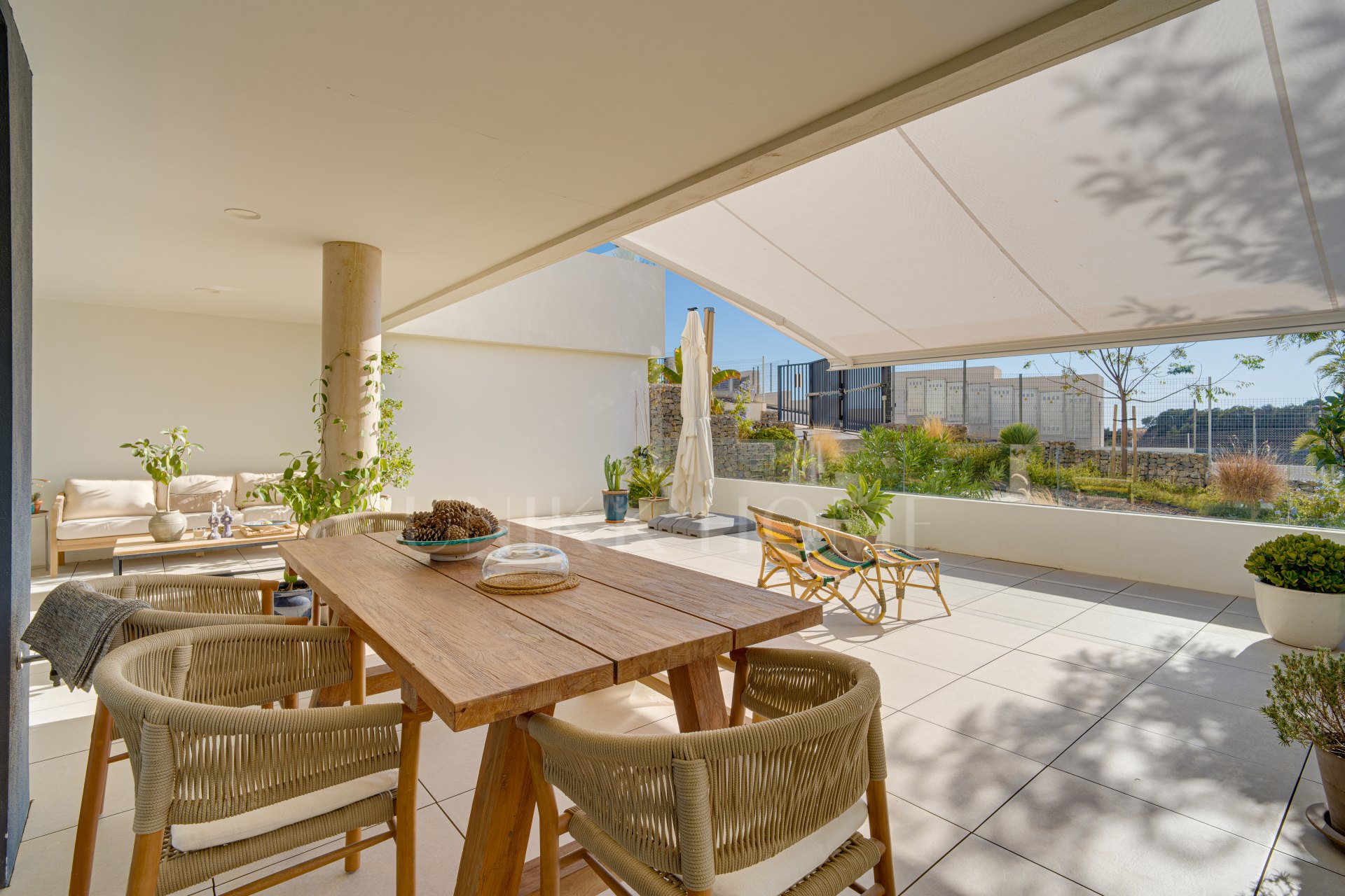 Beautifully designed, two-bedroom ground-floor apartment located in the sought-after Medblue community of Altos de Los Monteros, Marbella