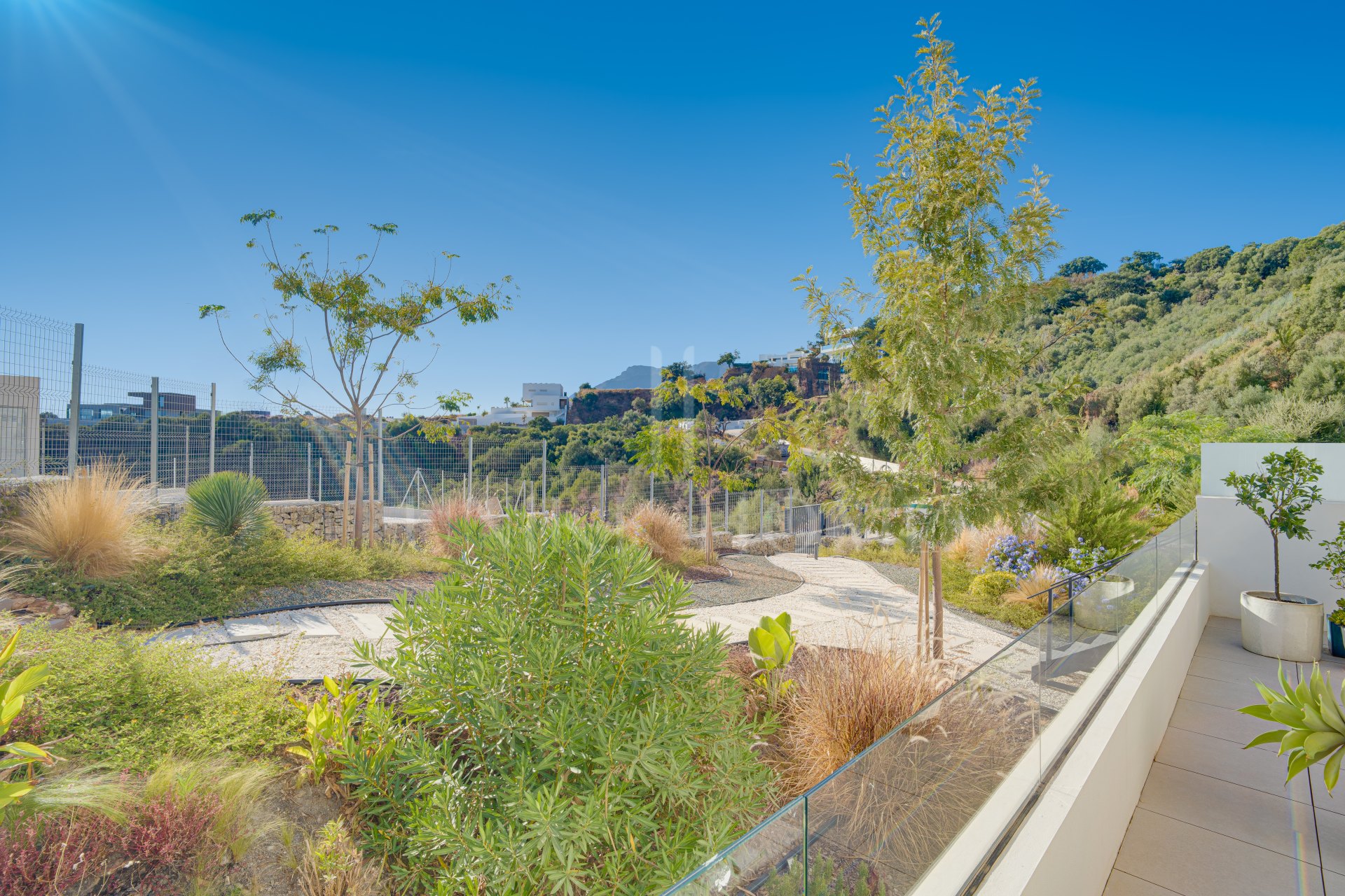 Beautifully designed, two-bedroom ground-floor apartment located in the sought-after Medblue community of Altos de Los Monteros, Marbella