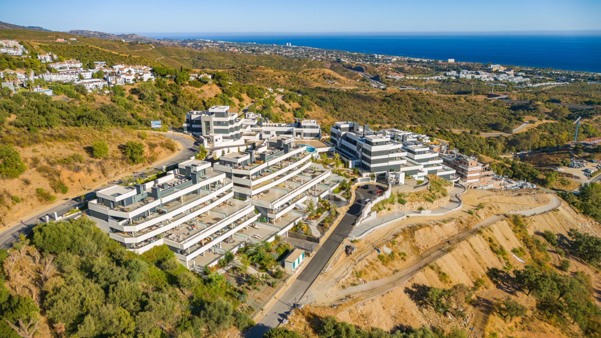 Beautifully designed, two-bedroom ground-floor apartment located in the sought-after Medblue community of Altos de Los Monteros, Marbella