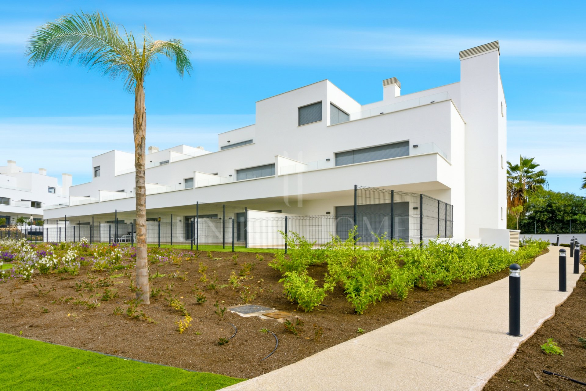 Stylish, southwest facing two bedroom apartment located in the sought-after gated community Acqua Gardens on the New Golden Mile, Estepona