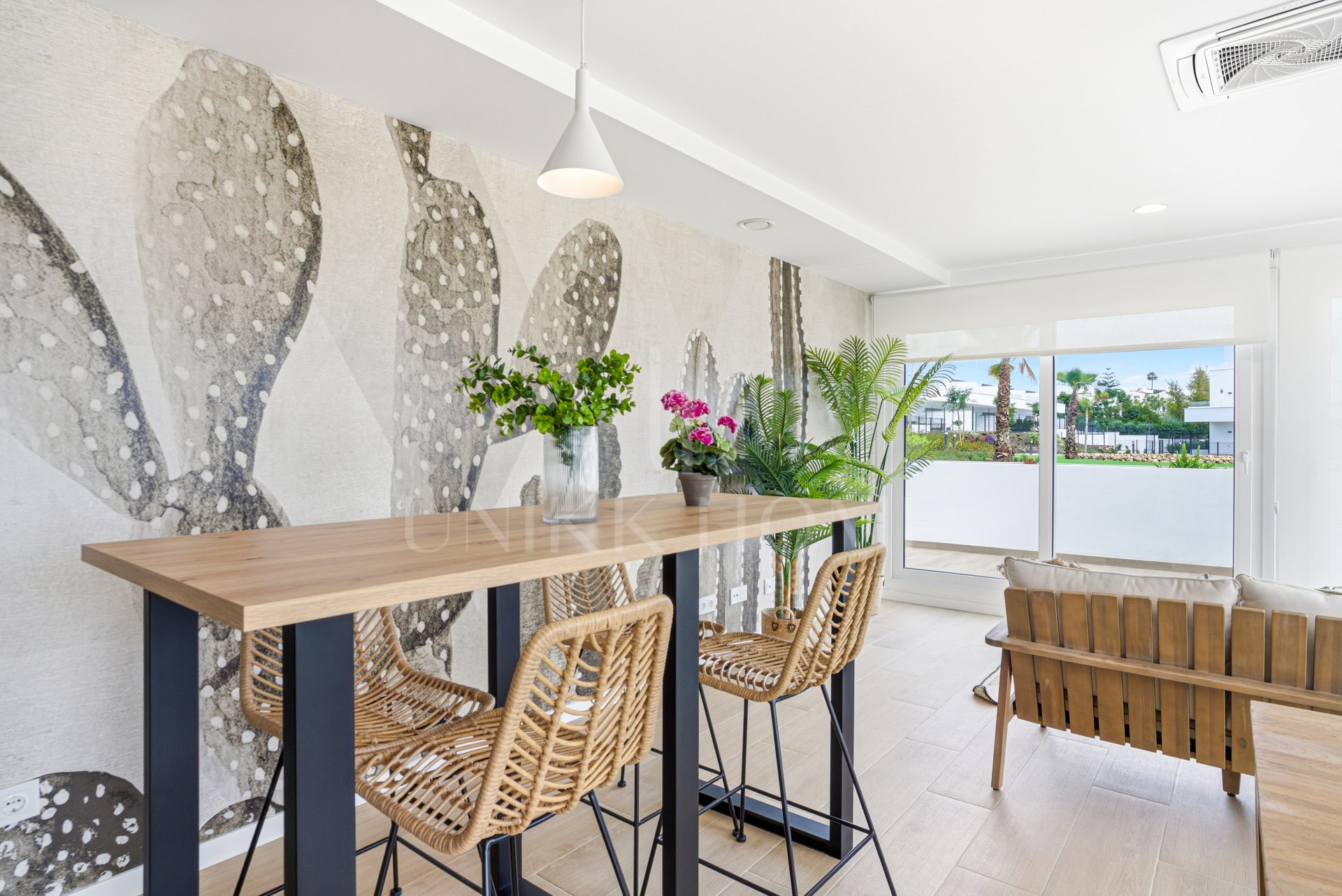 Stylish, southwest facing two bedroom apartment located in the sought-after gated community Acqua Gardens on the New Golden Mile, Estepona