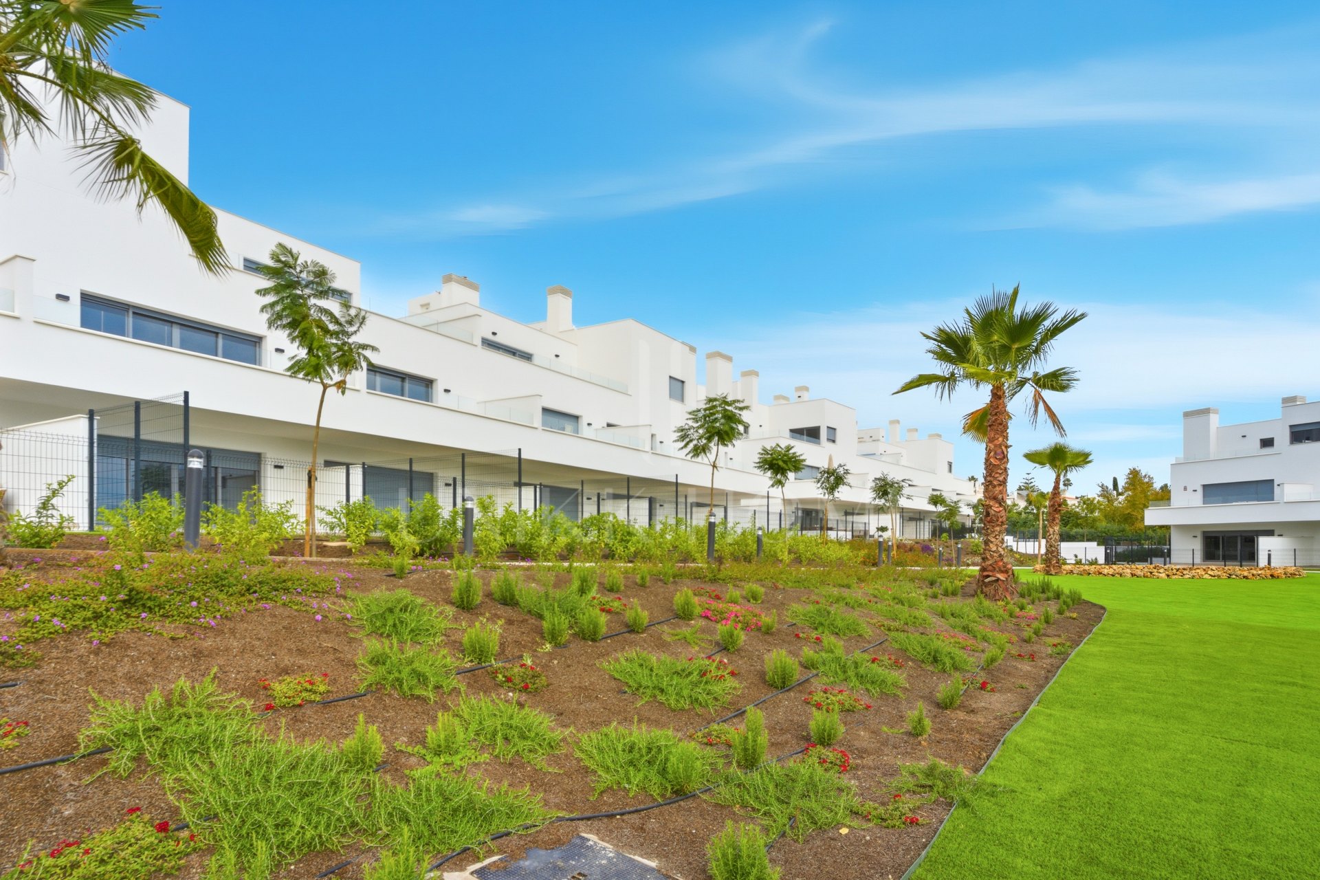 Stylish, southwest facing two bedroom apartment located in the sought-after gated community Acqua Gardens on the New Golden Mile, Estepona