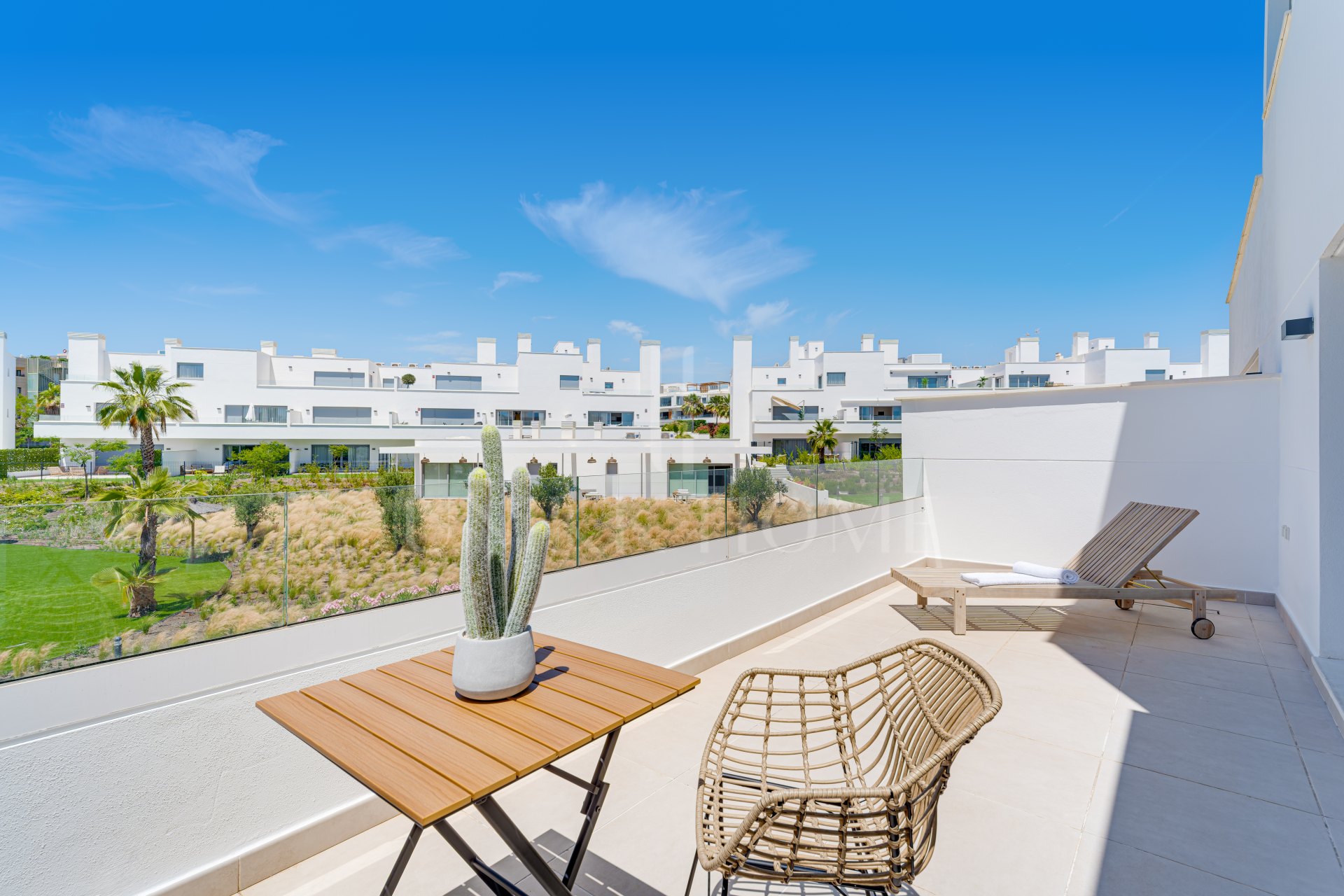 Stylish, southwest facing two bedroom apartment located in the sought-after gated community Aqua Gardens on the New Golden Mile, Estepona
