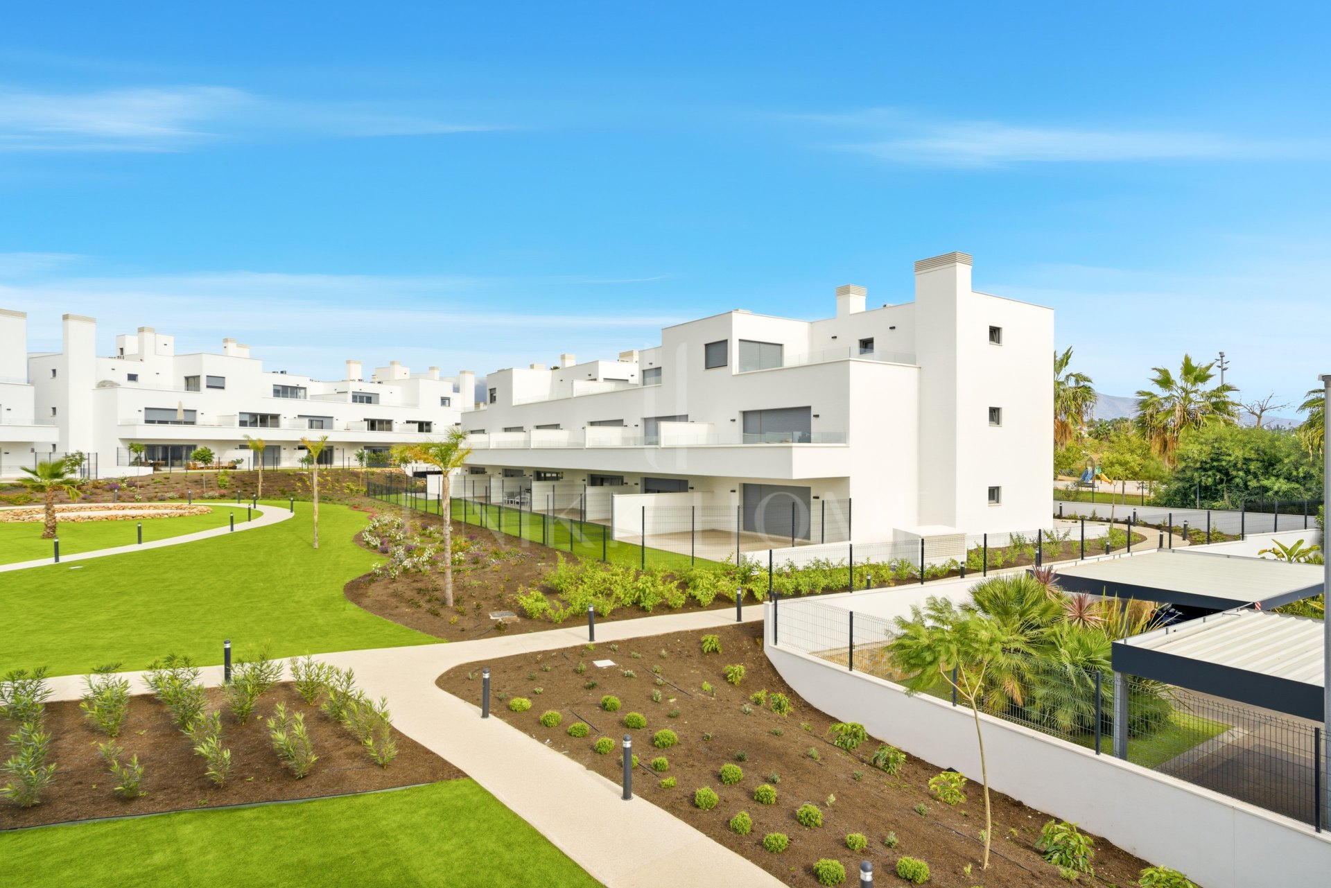 Stylish, southwest facing two bedroom apartment located in the sought-after gated community Acqua Gardens on the New Golden Mile, Estepona