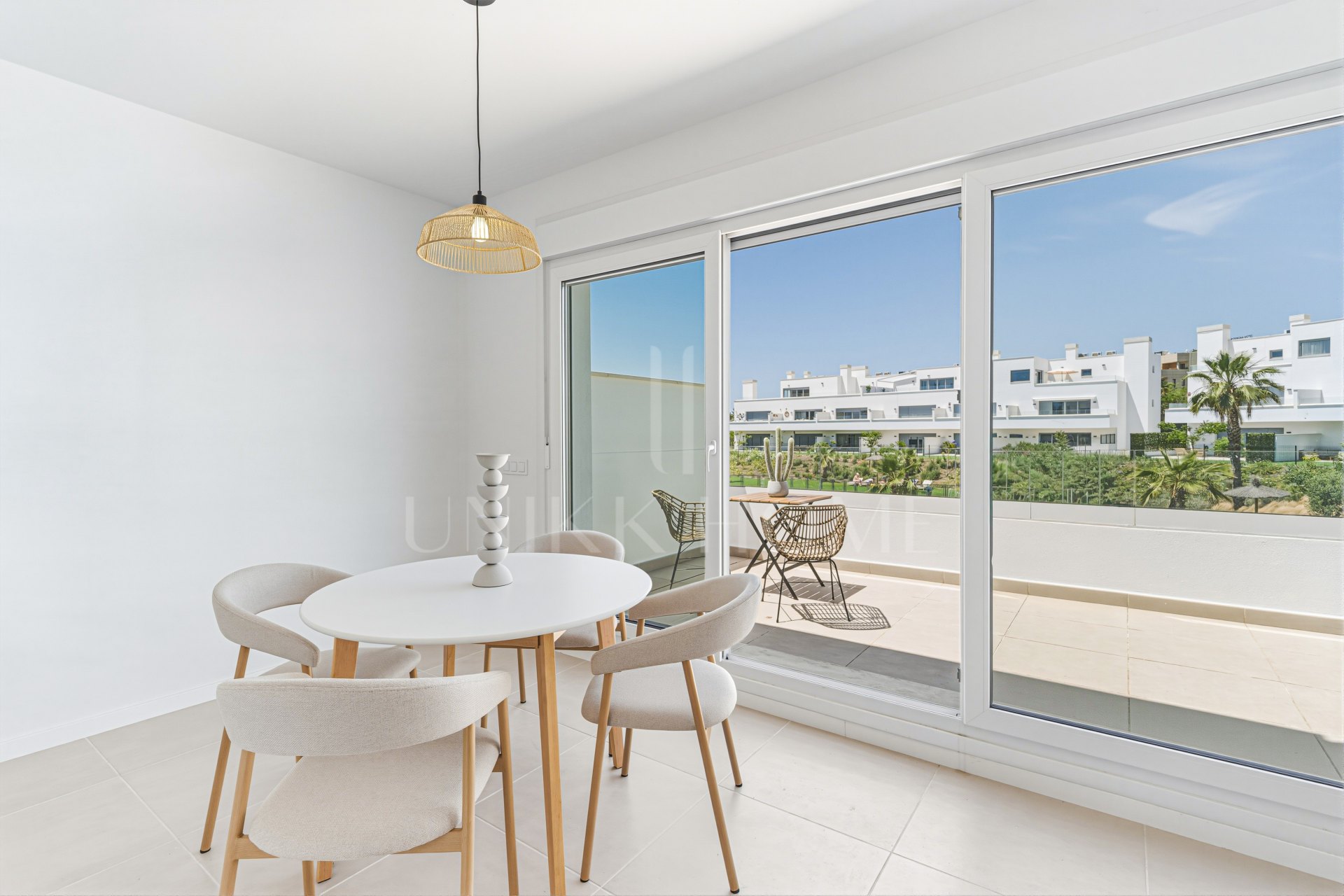 Stylish, southwest facing two bedroom apartment located in the sought-after gated community Aqua Gardens on the New Golden Mile, Estepona