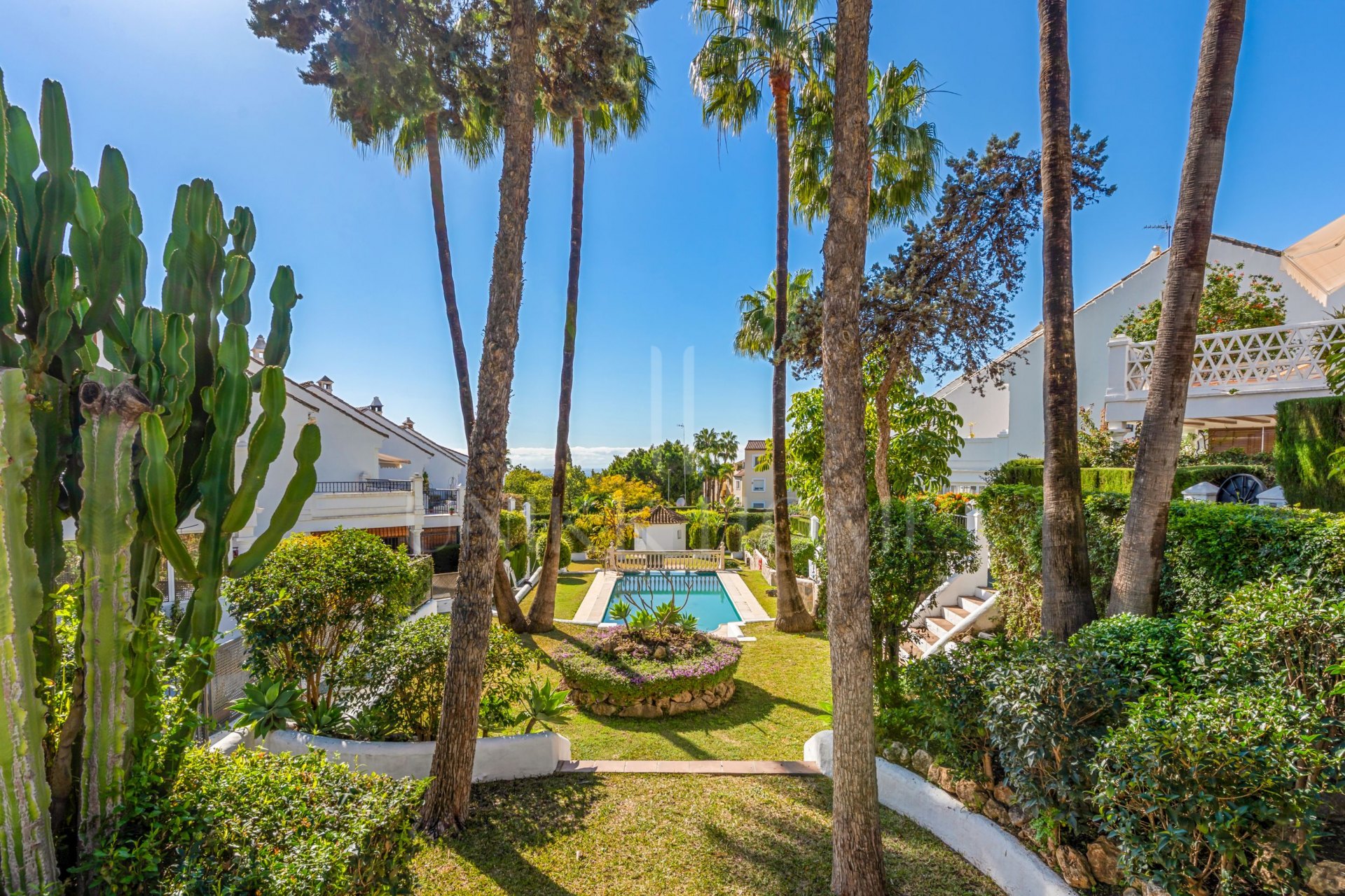 South-facing four-bedroom townhouse located in the gated community of Montepiedra , Nagueles within the Golden Mile, Marbella