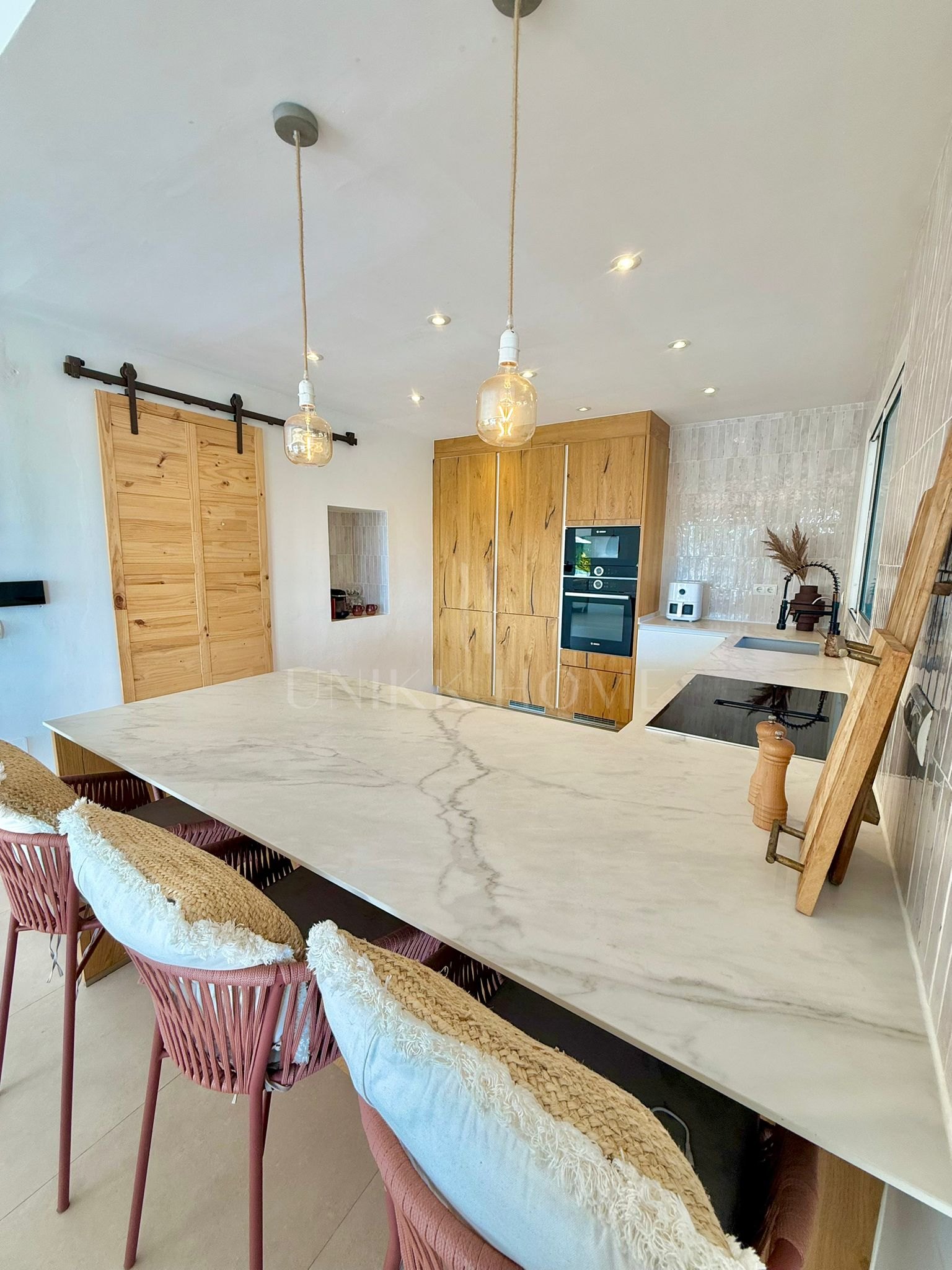 Beautifully renovated, south west facing three bedroom Villa located in Riviera del Sol, Mijas Costa with sea views