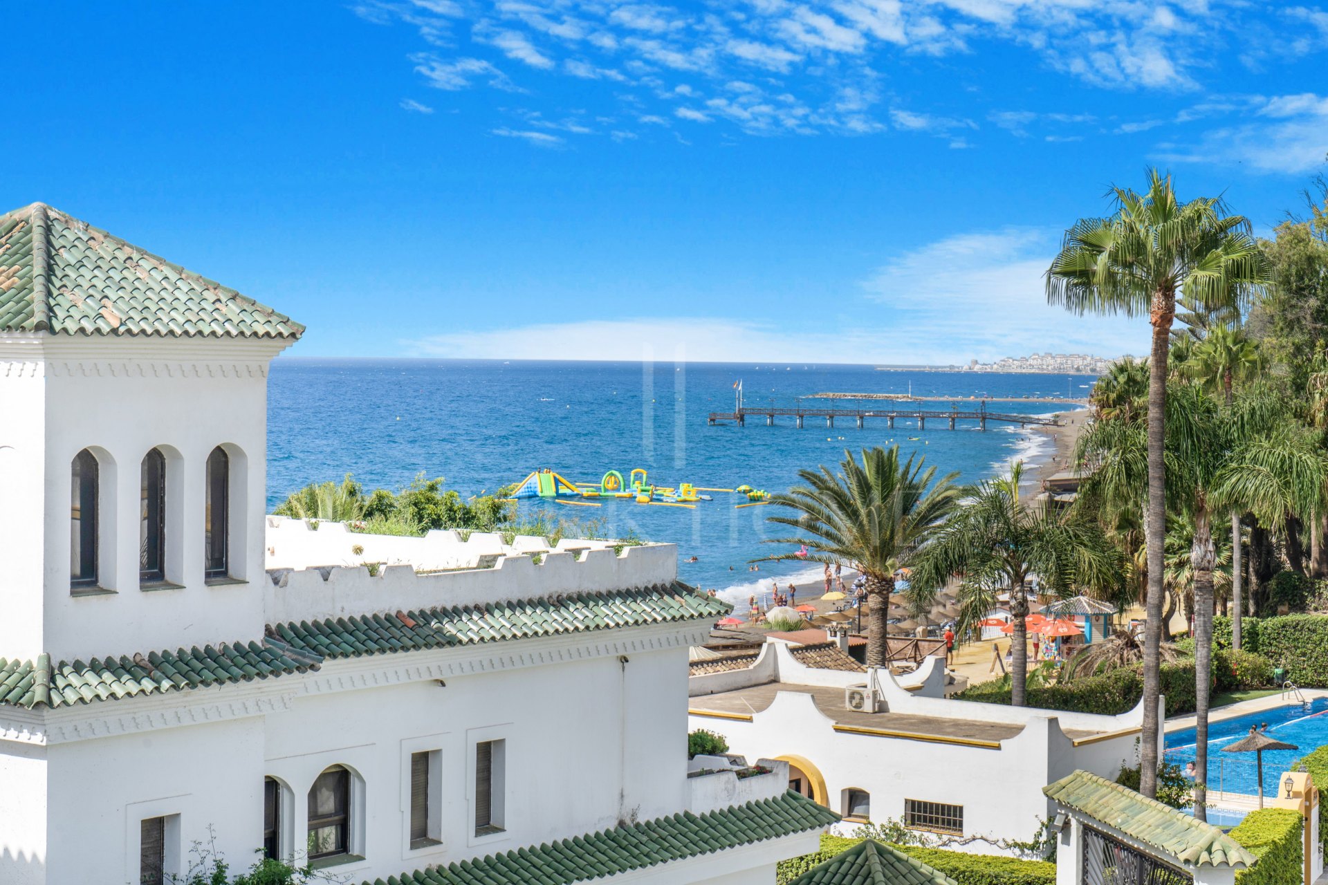 Beautiful frontline beach, four-bedroom end townhouse in the prestigious community of Marbellamar, on Marbella Golden Mile