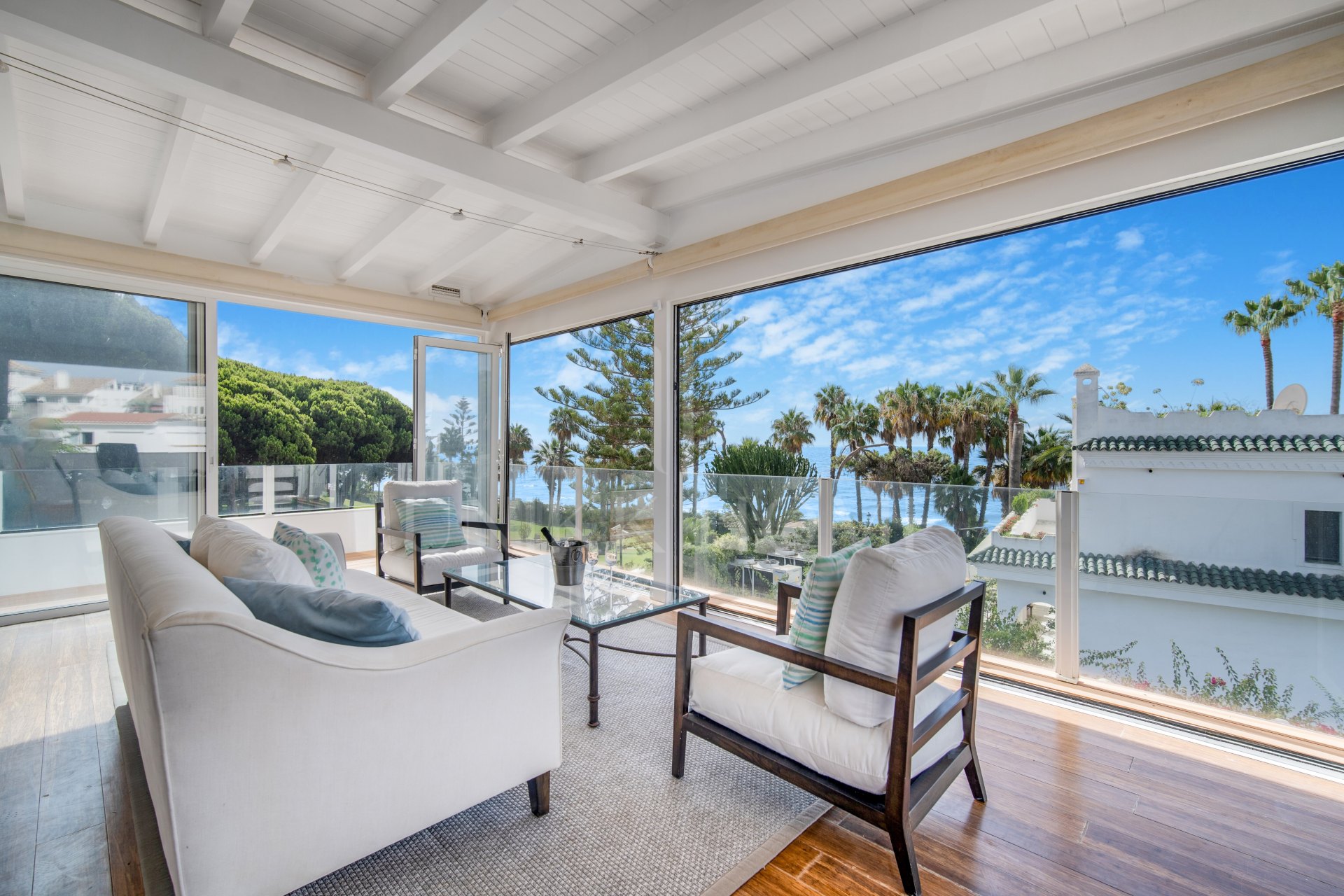 Beautiful frontline beach, four-bedroom end townhouse in the prestigious community of Marbellamar, on Marbella Golden Mile
