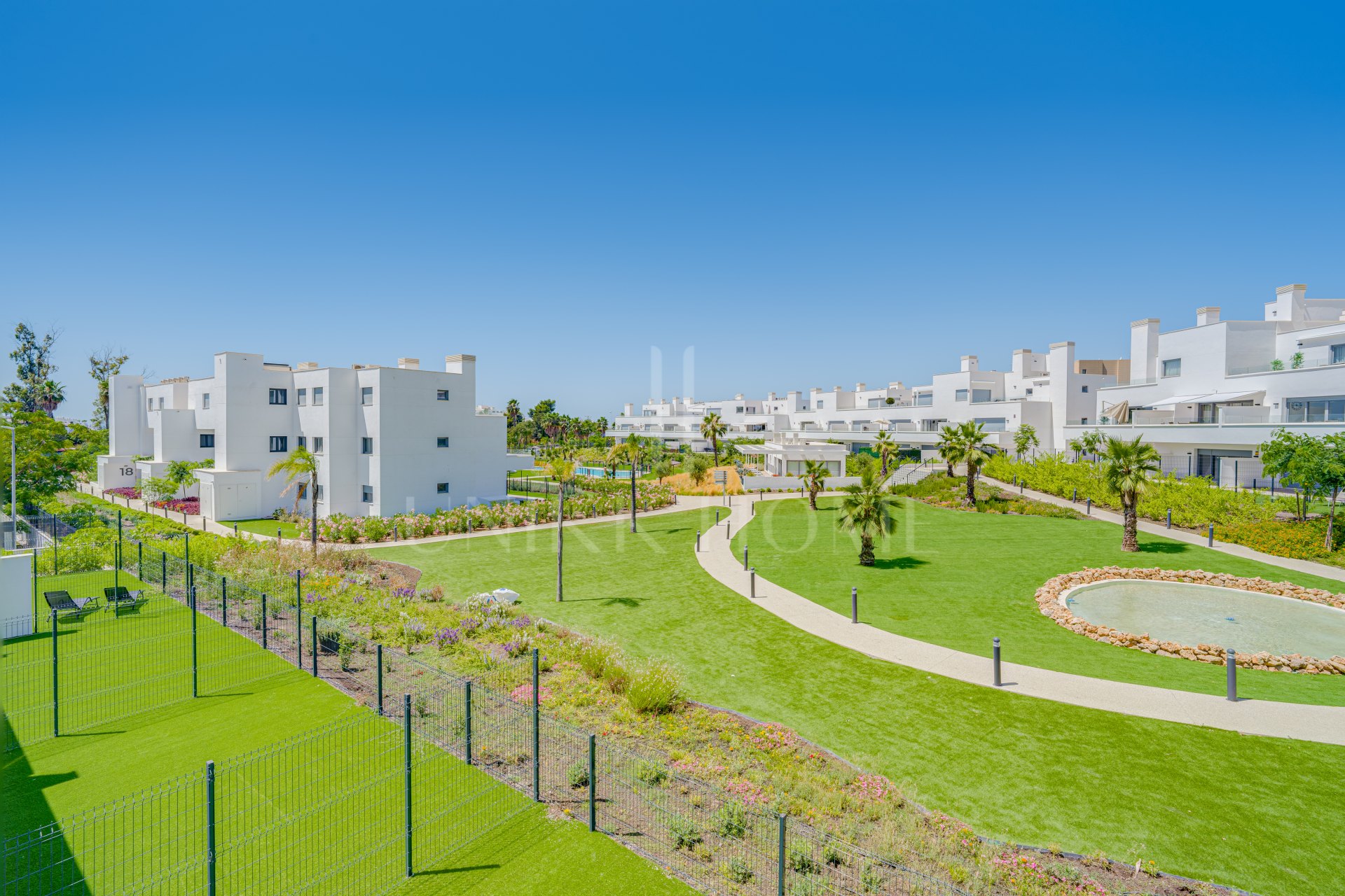 Brand new southwest facing two bedroom apartment located in the sought-after gated community Acqua Gardens, Estepona