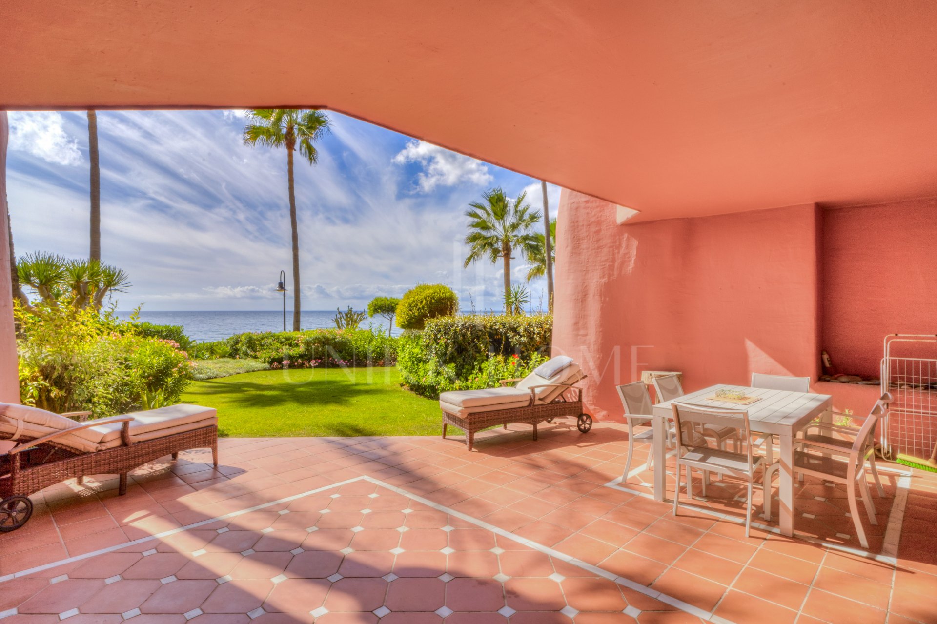 Impressive two bedroom, beach front ground floor apartment located in the luxury gated community of Menara Beach, Estepona.