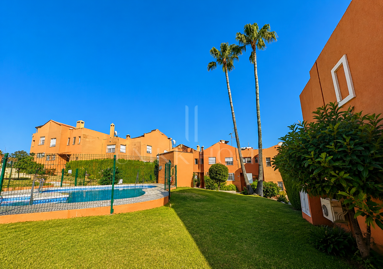Townhouse in Diana Park, with private patio, in a gated community with communal pool near the beach and amenities