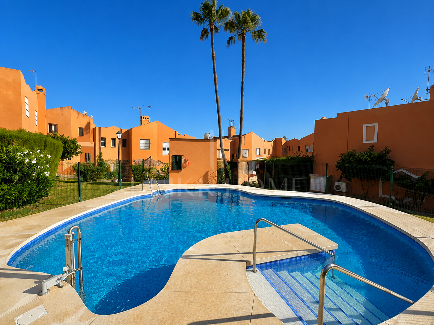 Townhouse in Diana Park, with private patio, in a gated community with communal pool near the beach and amenities