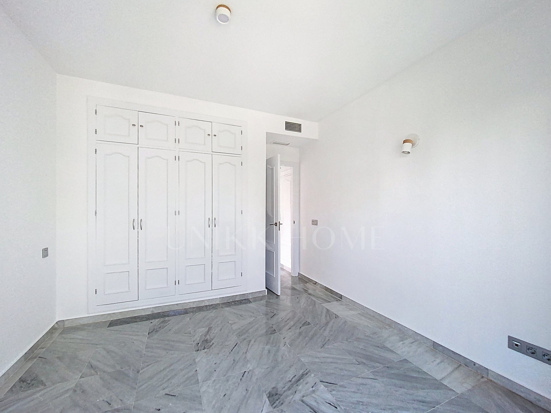 Elevated Ground Floor Sea View Apartment for Sale in Estepona East – Large Terraces & Jacuzzi
