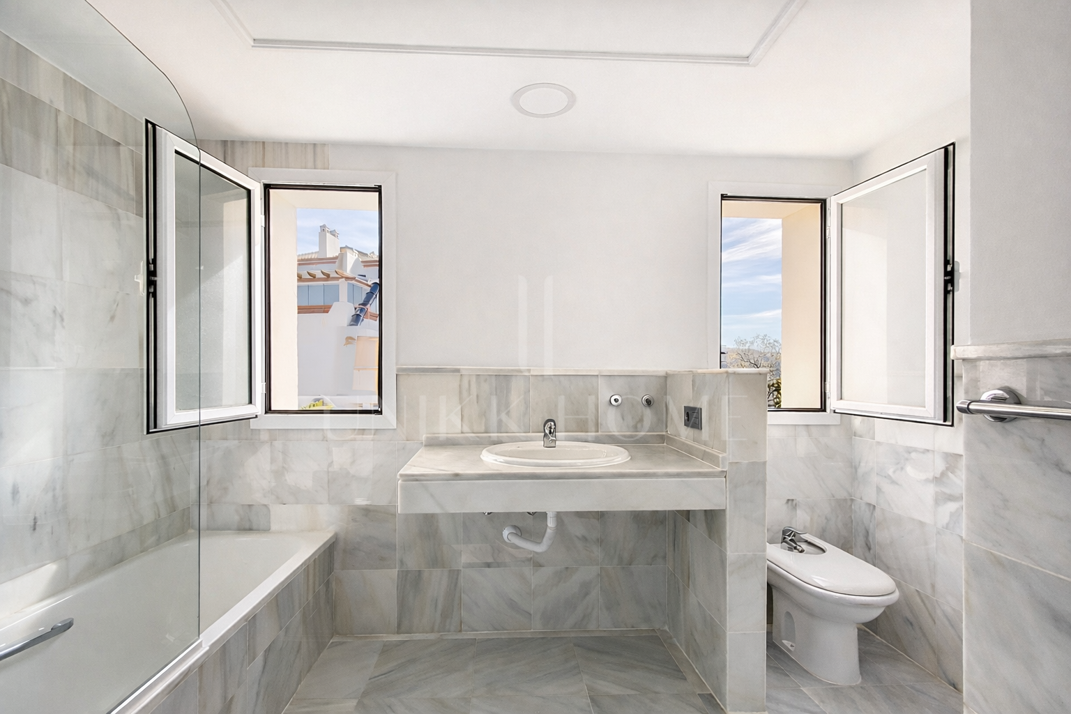 Elevated Ground Floor Sea View Apartment for Sale in Estepona East – Large Terraces & Jacuzzi